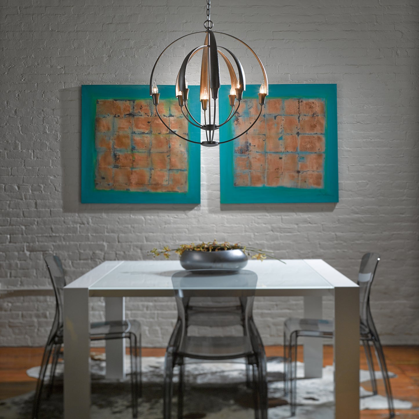 White dining table paired with transparent chairs, showcasing modern design.