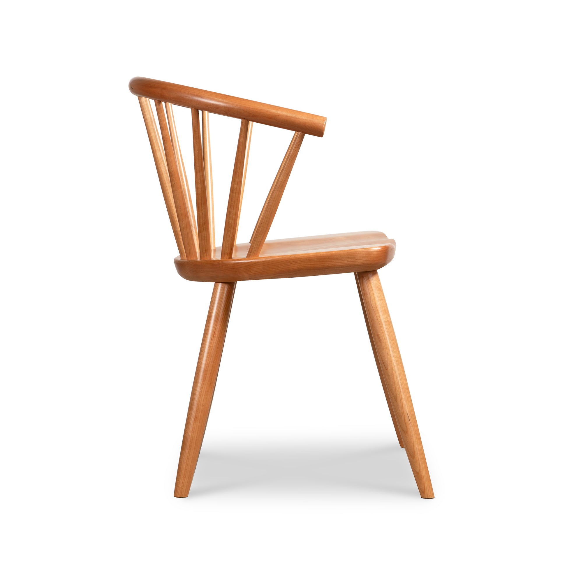 Side view of Dover Curveback Windsor Chair in Cherry by Vermont Woods Studios, showcasing elegant craftsmanship and American made quality.