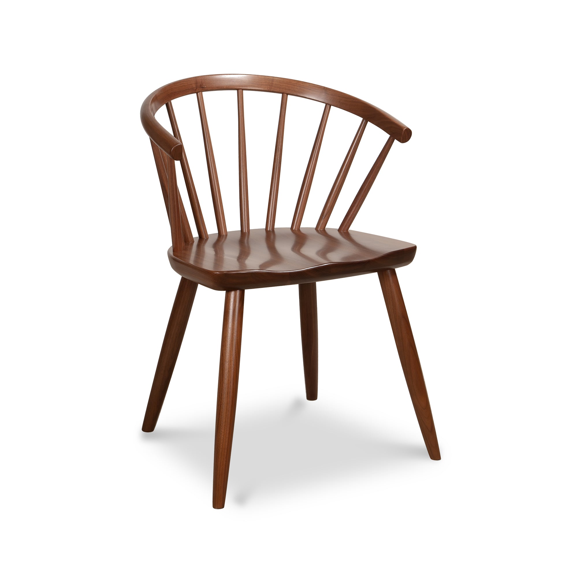 Dover Curveback Windsor Chair in rich walnut by Vermont Woods Studios with curved back, vertical slats, angled legs, and smooth contoured seat.