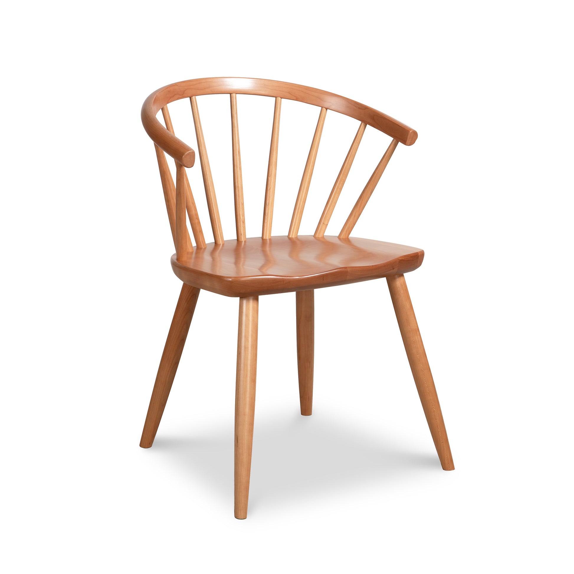 Dover Curveback Windsor Chair in cherry by Vermont Woods Studios, showcasing a curved back, vertical slats, and angled legs, American made.