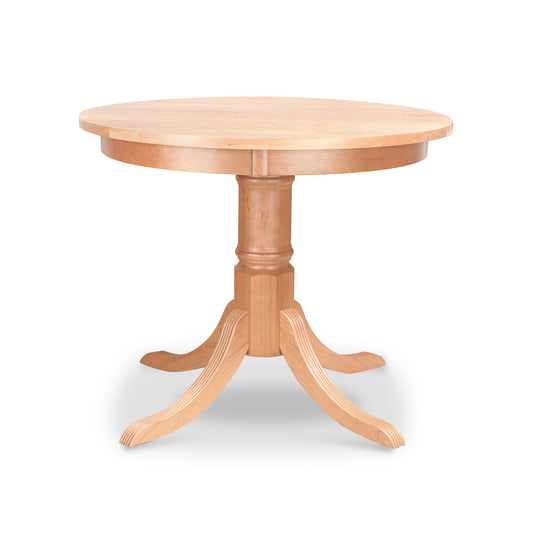 Lyndon Furniture Duncan-Phyfe Round Pedestal Dining Table with solid wood top and elegant four curved legs, displayed on a white background.
