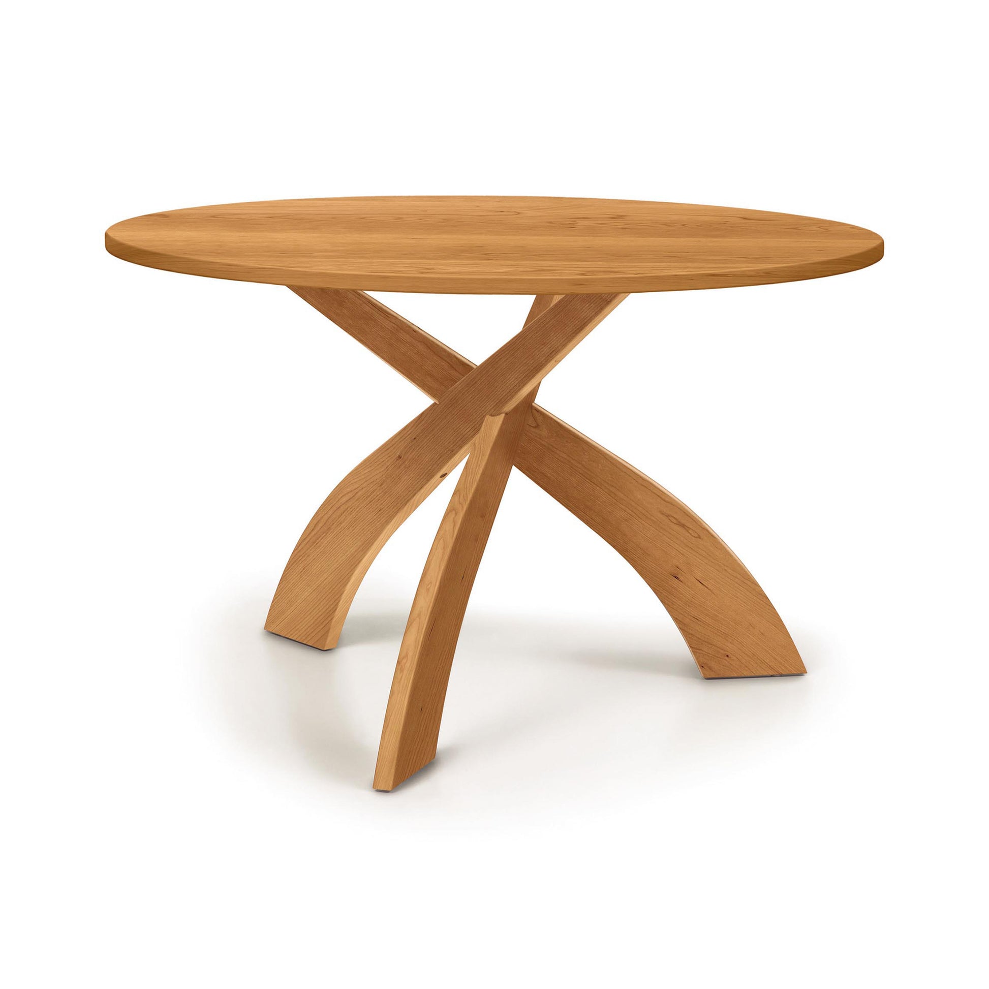 Entwine Round Solid Top Table by Copeland Furniture with three curved wood legs, crafted in America, highlighting elegant design and expert craftsmanship.