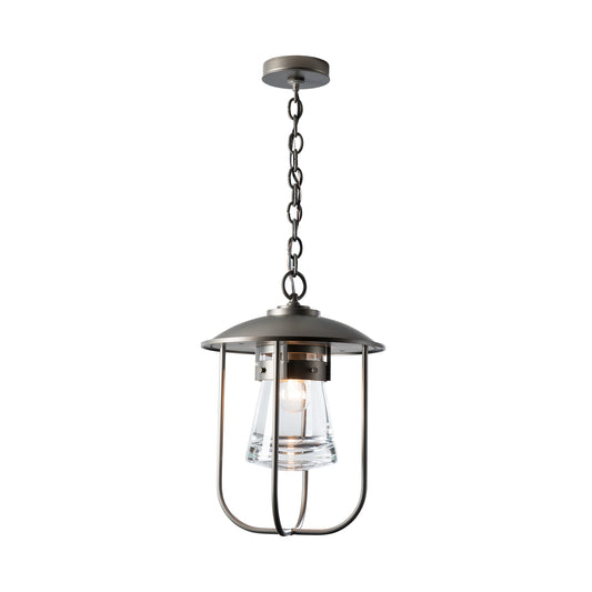 Close-up of the Erlenmeyer Outdoor Pendant by Hubbardton Forge, highlighting its industrial metal frame, glass shade, and exposed bulb.