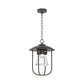 Hubbardton Forge Erlenmeyer Outdoor Pendant with black metal frame, clear glass shade, and exposed bulb, crafted in Vermont for quality and style.