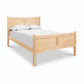 Essex High Footboard Bed by Vermont Furniture Designs shown with matching headboard and footboard, white mattress, and two pillows.