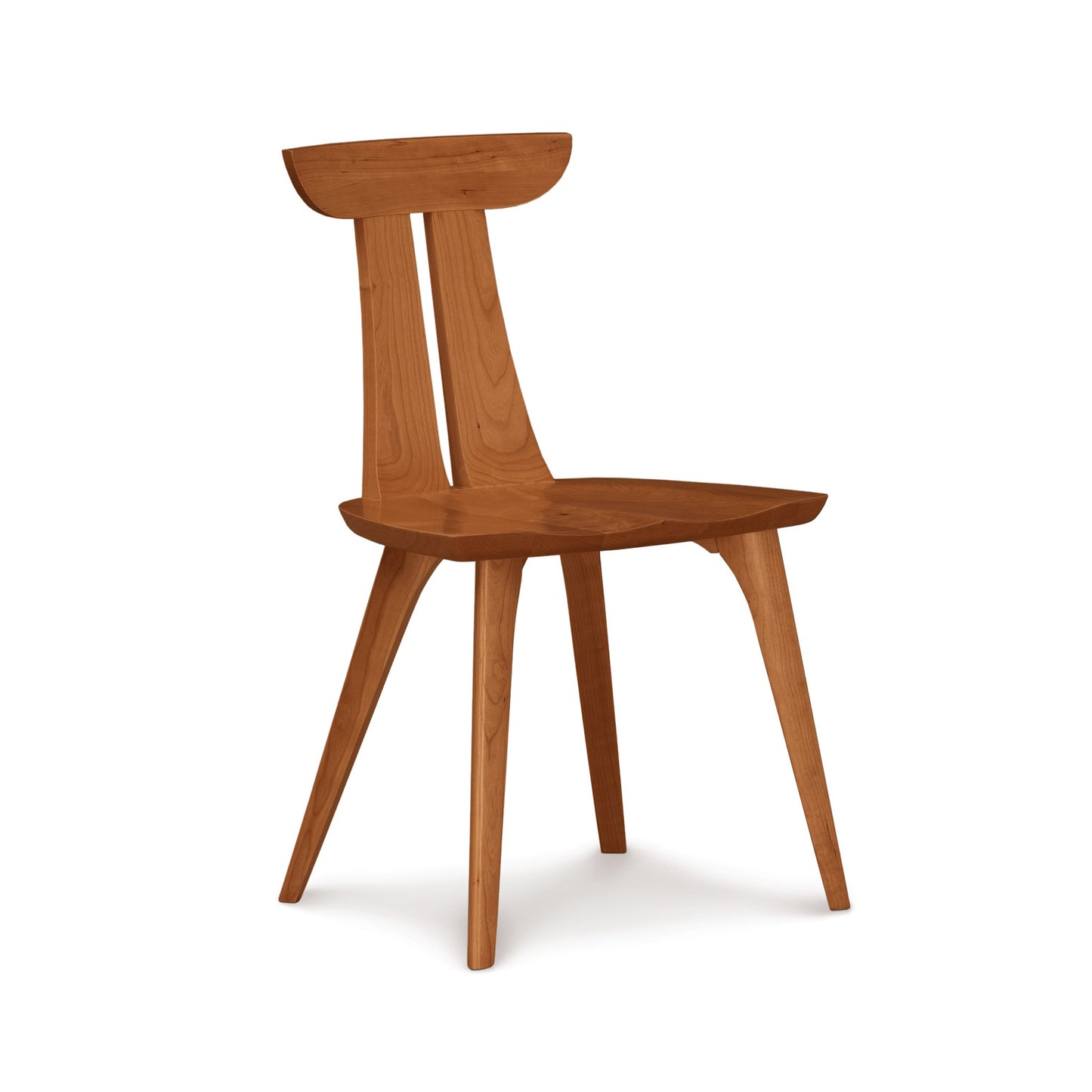 Minimalist Estelle Chair by Copeland Furniture features a curved backrest and angled legs, expertly crafted from American hardwoods.