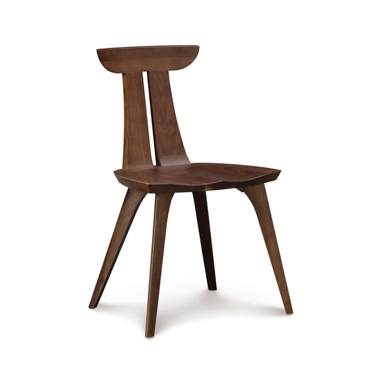 Estelle Side Chair by Copeland Furniture highlighting its curved back, angled legs, and contoured seat crafted in high quality American wood.