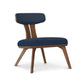 Estelle Lounge Chair by Copeland Furniture with angled legs, a curved back, and dark blue upholstery, showcasing elegant American craftsmanship.