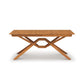Exeter Extension Dining Table by Copeland Furniture, crafted from solid North American hardwood with butterfly leaf and distinctive crossed legs.