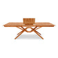 Exeter Extension Dining Table by Copeland Furniture in solid North American hardwood featuring crossed legs and butterfly leaf extension.