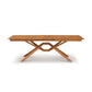 Copeland Furniture Exeter Extension Dining Table featuring a crisscross base and butterfly leaf.