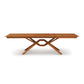 Exeter Extension Dining Table with geometric crisscross base and butterfly leaf extension, crafted from North American hardwood by Copeland Furniture.