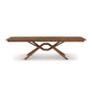 Copeland Furniture Exeter Extension Dining Table with rectangular top, distinctive crisscrossed base, and integrated butterfly leaf extension.