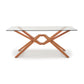 Exeter Rectangular Glass Top Table by Copeland Furniture with unique angled intersecting legs and central hexagonal design, showcasing modern craftsmanship.