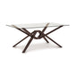 Copeland Furniture Exeter Rectangular Glass Top Table with intersecting solid hardwood legs and sleek modern lines.