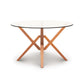 Copeland Furniture Exeter Round Glass Top Table with sculptural geometric hardwood base, showcasing modern craftsmanship and elegant design.