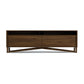 Exeter Media Cabinet by Copeland Furniture with two open shelves, two large drawers, angled legs, and a rich dark brown hardwood finish.