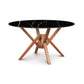 Exeter Round Table with glossy black marble-top and geometric hardwood base by Copeland Furniture.