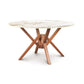 Exeter Round Table with sintered stone top and sustainably sourced hardwood base by Copeland Furniture.