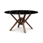 Exeter Round Table with Black Sintered Stone Top and Geometric Sustainable Hardwood Base by Copeland Furniture.