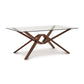 Exeter Rectangular Glass Top Table by Copeland Furniture with a striking geometric hardwood base and sleek modern design.