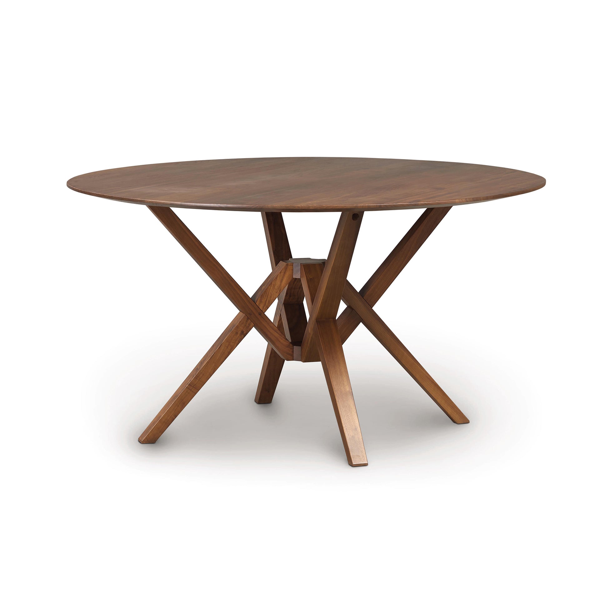Exeter Round Solid Top Dining Table by Copeland Furniture, showcasing a smooth hardwood surface and distinctive geometric legs, expertly crafted from sustainable wood.