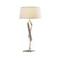 Angular metallic base table lamp with white shade, Hubbardton Forge Facet design.