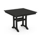 Black square POLYWOOD Farmhouse Trestle outdoor table with slatted top.