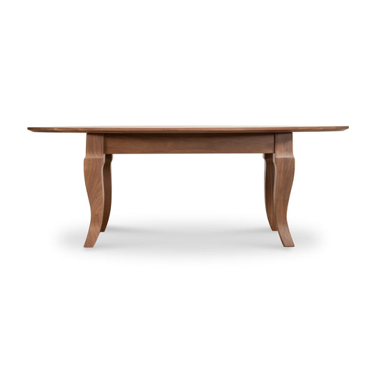 Lyndon Furniture French Country oval coffee table with elegant curved legs and rich walnut finish, side profile highlighting craftsmanship.