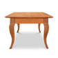 Lyndon Furniture French Country Coffee Table with a rectangular hardwood top and elegant curved legs, crafted from sustainably sourced wood.