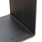 Close-up of the G Table by Vermont Woods Studios, highlighting its unique L-shaped metal bracket with a textured dark finish.