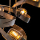 Graffiti Pendant by Hubbardton Forge with glowing bulbs and elegant curved metal design, handcrafted in Vermont.