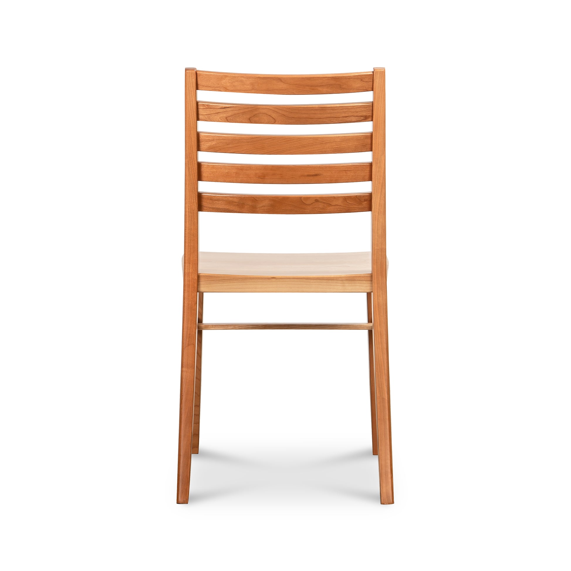 The Grafton Chair by Vermont Woods Studios features a slatted back, straight legs, and a smooth natural wood seat, expertly crafted in the USA.