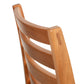 Grafton Chair by Vermont Woods Studios with a smooth, curved natural wood backrest and horizontal slats, highlighting American craftsmanship.
