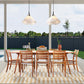 Eight Grafton Chairs by Vermont Woods Studios encircle a solid wood dining table, showcasing American-made craftsmanship and quality furniture design.
