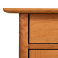 Heartwood Shaker 1-Drawer Nightstand by Vermont Furniture Designs, highlighting the finely crafted wood grain and detailing on the upper left corner.