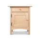 Heartwood Shaker 1-Drawer Nightstand with Door in light wood by Vermont Furniture Designs, highlighting its craftsmanship and clean shaker style.