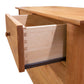 Heartwood Shaker 4-Drawer Dresser by Vermont Furniture Designs featuring visible dovetail joints and smooth metal slides on an open drawer.
