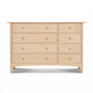 Heartwood Shaker 8-Drawer Dresser by Vermont Furniture Designs, crafted from solid hardwood with a light finish and round wooden knobs.