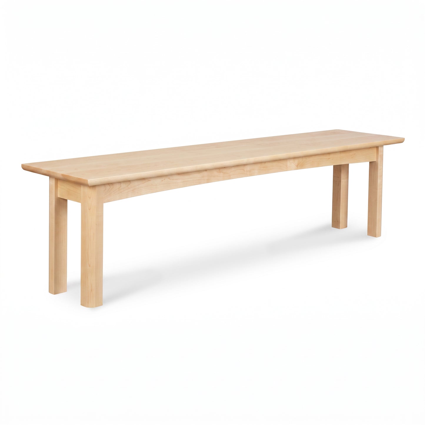 Heartwood Shaker Bench by Vermont Furniture Designs, crafted from light hardwood with four legs, highlighting quality American craftsmanship.