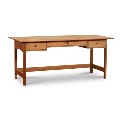 Heartwood Shaker Campaign Desk by Vermont Furniture Designs featuring a modern flat top, three drawers, and a sturdy crossbar.