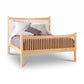 Heartwood Shaker High Footboard Bed by Vermont Furniture Designs in solid wood with vertical slats and a lavender duvet.