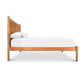 Vermont Furniture Designs Heartwood Shaker Low Footboard Bed featuring a tall slatted headboard with an eco-oil finish and white bedding.