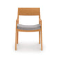Copeland Furniture Iso Chair crafted from sustainable hardwood, featuring a straight back, armrests, and gray upholstered seat.