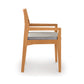 Iso Chair by Copeland Furniture features a cherry wood frame, armrests, and light gray seat upholstery, viewed from the side.