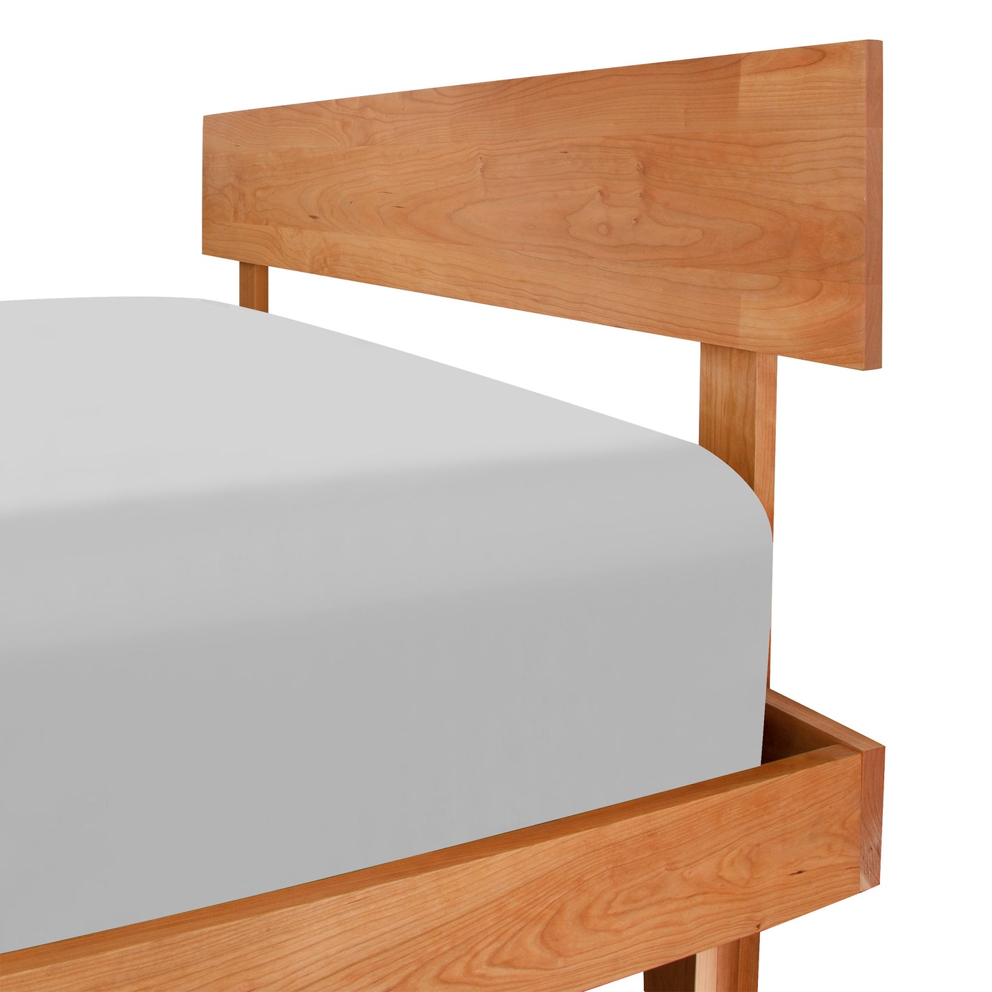 Kipling Bed by Vermont Furniture Designs showcasing a solid wood frame and minimalist headboard with natural finish and white mattress.