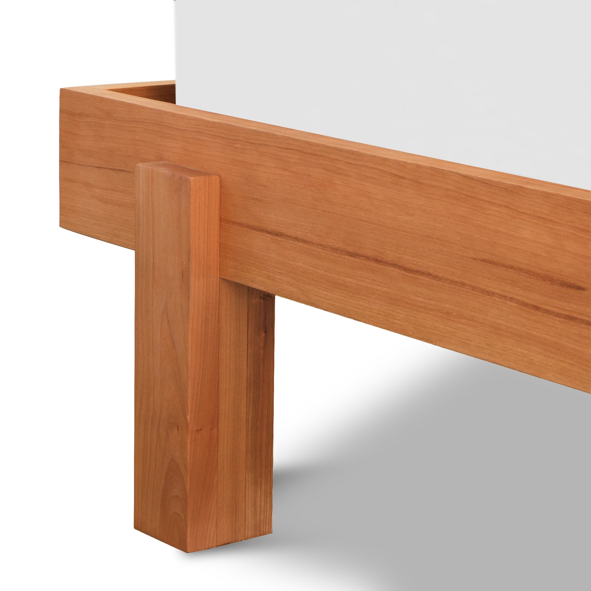 Kipling Bed by Vermont Furniture Designs featuring a customizable solid wood frame with vertical legs in a light brown finish.