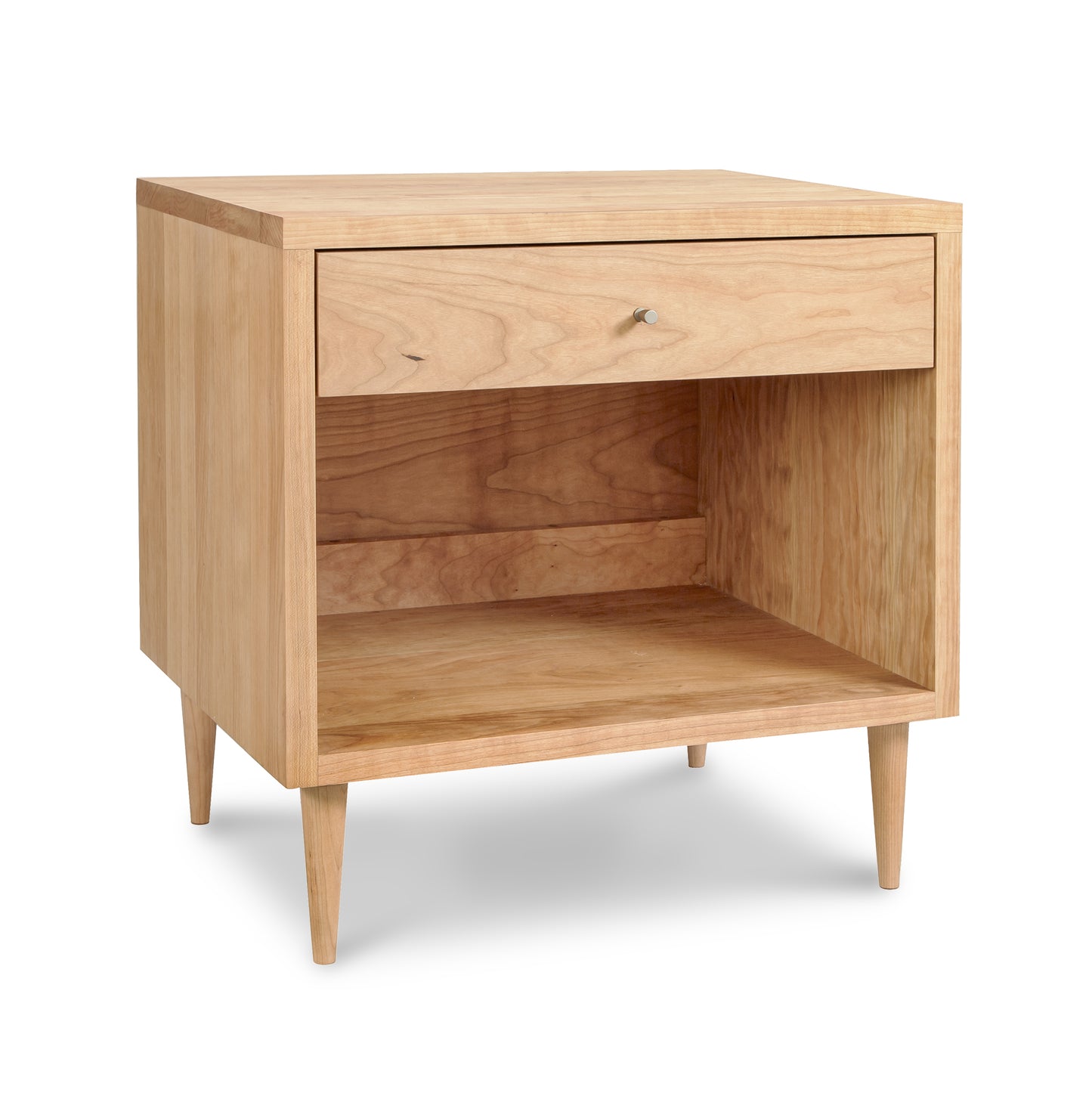 Larssen 1-Drawer Wide Nightstand by Vermont Furniture Designs, featuring mid-century design with a natural finish, tapered legs, an open shelf, and single drawer.