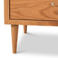 Larssen 3-Drawer Nightstand by Vermont Furniture Designs, highlighting its mid-century tapered legs, metal handle, and hardwood craftsmanship.