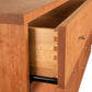 Larssen 8-Drawer Dresser by Vermont Furniture Designs with dovetail joints and sleek metallic handles, showcasing fine craftsmanship and elegant design.